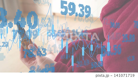 Holding amber dropper, woman in maroon robe writing notebook at home with blue data overlay Holding amber dropper, woman in maroon robe writing notebook at home with blue data overlay 141071719