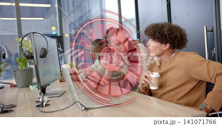 Leaning male wearing tan sweater and watch holding paper cup coworking desk with HUD, copy space Leaning male wearing tan sweater and watch holding paper cup coworking desk with HUD, copy space 141071766