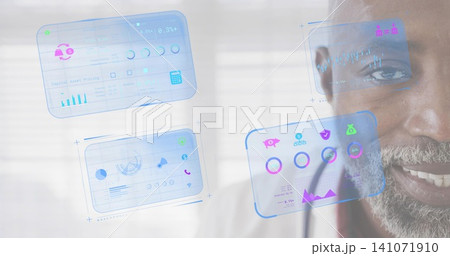 Smiling senior man, gray beard, collared shirt studying holographic UI panels at window, copy space Smiling senior man, gray beard, collared shirt studying holographic UI panels at window, copy space 141071910
