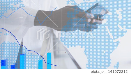 Tapping phone and scrolling tablet, mature man wearing white shirt at office with map and charts Tapping phone and scrolling tablet, mature man wearing white shirt at office with map and charts 141072212