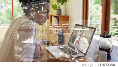 Sitting mature woman viewing remote call on laptop at home-office HUD overlays, blouse, copy space 141072356
