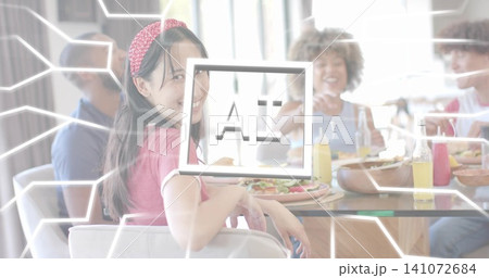 Smiling woman in pink headband and top turning toward camera at glass table, with AI overlay Smiling woman in pink headband and top turning toward camera at glass table, with AI overlay 141072684