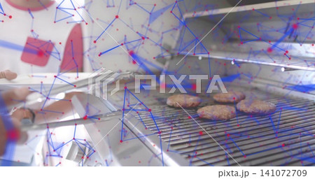 Flipping red-apron cook using tongs on stainless grill in kitchen with four patties, AR overlay Flipping red-apron cook using tongs on stainless grill in kitchen with four patties, AR overlay 141072709