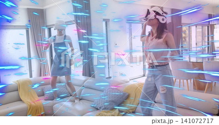 Adjusting woman in pink blouse, ripped jeans, tuning white VR headset in living room, copy space Adjusting woman in pink blouse, ripped jeans, tuning white VR headset in living room, copy space 141072717