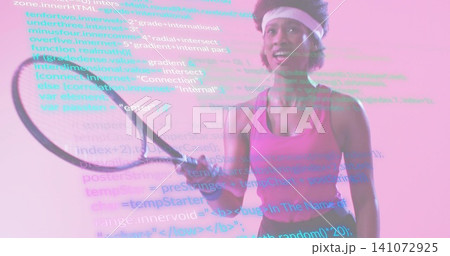 Holding tennis racket, woman wearing pink tank top and white headband at studio with projected code 141072925