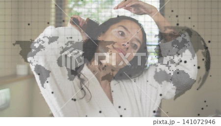 Brushing woman combing hair in bathroom with hairbrush, white bathrobe, blinds, sink, map overlay Brushing woman combing hair in bathroom with hairbrush, white bathrobe, blinds, sink, map overlay 141072946