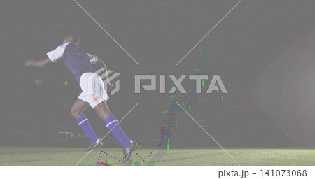 Sprinting player in kit chasing ball on pitch at night under lights with candlestick, copy space Sprinting player in kit chasing ball on pitch at night under lights with candlestick, copy space 141073068