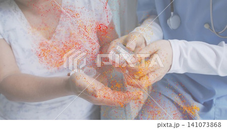 Pouring tablets nurse-in-blue-scrubs guiding bottle into patterned-gown palm at ward, orange speck Pouring tablets nurse-in-blue-scrubs guiding bottle into patterned-gown palm at ward, orange speck 141073868