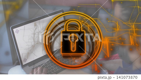 Displaying central padlock overlay dominating laptop at home office, hands typing on keyboard Displaying central padlock overlay dominating laptop at home office, hands typing on keyboard 141073870