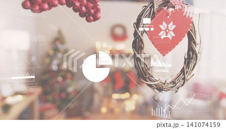 Hanging twig wreath with red snowflake heart and digital overlays in cozy living room, copy space Hanging twig wreath with red snowflake heart and digital overlays in cozy living room, copy space 141074159