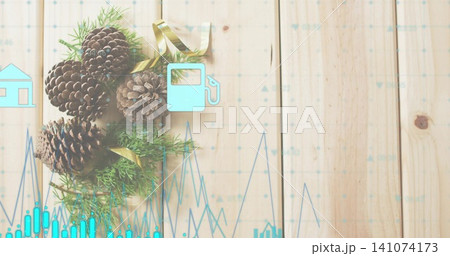 Displaying pine cones with green sprigs and gold ribbon on pale wooden planks, aqua data overlays 141074173