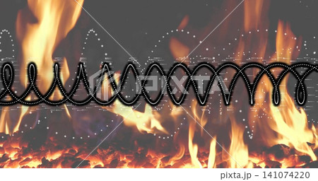 Glowing band of coals and flames flickering in hearth, black ribbon with white dotted highlights 141074220