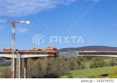 Bridge construction progressing over Bernartice, Czechia valley 141074552