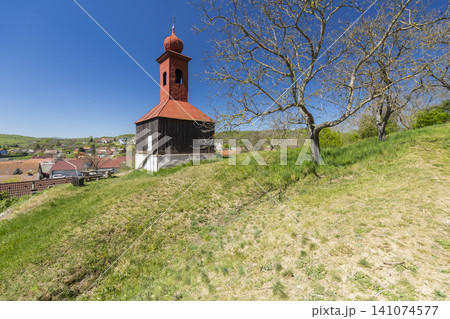 Village belfry on a hill overlooking Moravske Branice Village belfry on a hill overlooking Moravske Branice 141074577