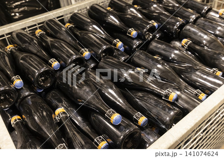 Sparkling wine bottles resting in fermentation racks in Havraniky Sparkling wine bottles resting in fermentation racks in Havraniky 141074624