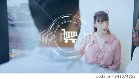 Leading woman in pink top with tablet, glasses, team discussing marketing on office glass cart icon Leading woman in pink top with tablet, glasses, team discussing marketing on office glass cart icon 141074858