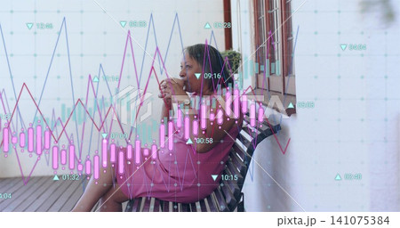 Holding white ceramic mug senior woman in pink dress sitting on porch, showing financial charts Holding white ceramic mug senior woman in pink dress sitting on porch, showing financial charts 141075384