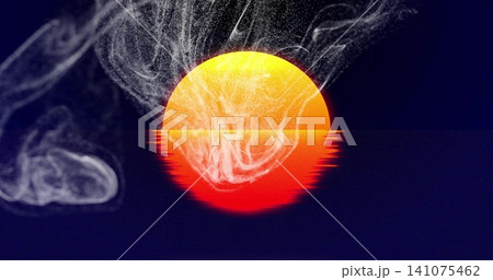 Glowing circular sun half-submerged casting red reflection across calm seascape horizon, with smoke 141075462