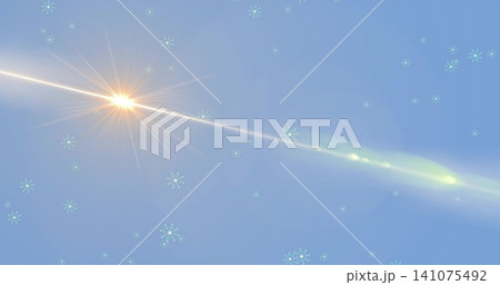 Radiating flare sending diagonal tail across pale sky, with lens-flare haze and turquoise sparkles Radiating flare sending diagonal tail across pale sky, with lens-flare haze and turquoise sparkles 141075492
