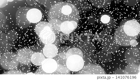 Glowing cluster of overlapping bokeh orbs creating depth on dark studio backdrop with speckle halos Glowing cluster of overlapping bokeh orbs creating depth on dark studio backdrop with speckle halos 141076196