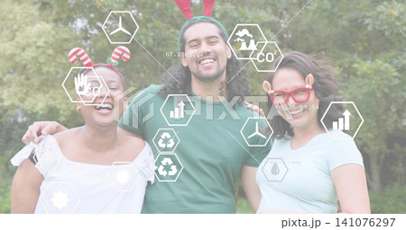 Smiling trio posing in park, in casual clothes, showing headbands, novelty glasses and hex overlays Smiling trio posing in park, in casual clothes, showing headbands, novelty glasses and hex overlays 141076297