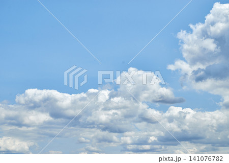 Cumulus cloudscape texture. Sunny summer sky background. Cumulus cloudscape texture. Sunny summer sky background. 141076782
