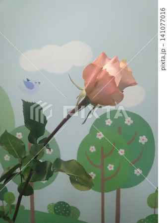 A single delicate peach rose stem captured in a vertical composition against a playful cartoon forest wallpaper background. This creative image is ideal for spring themes, greeting cards, or decor. A single delicate peach rose stem captured in a vertical composition against a playful cartoon forest wallpaper background. This creative image is ideal for spring themes, greeting cards, or decor. 141077016