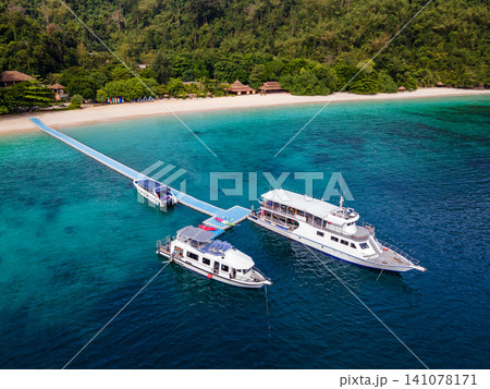 Aerial view of tropical beach landscape with tour boats at Nyaung Oo Phee island in Myanmar 141078171