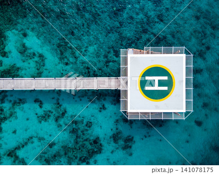 Aerial view of helipad over the sea Aerial view of helipad over the sea 141078175