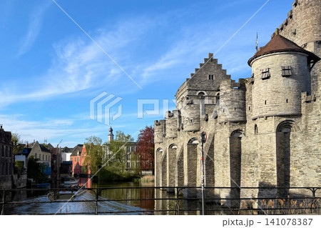 Medieval Gravensteen castle along the Leie River in the East Flanders city of Ghent Belgium. Medieval Gravensteen castle along the Leie River in the East Flanders city of Ghent Belgium. 141078387