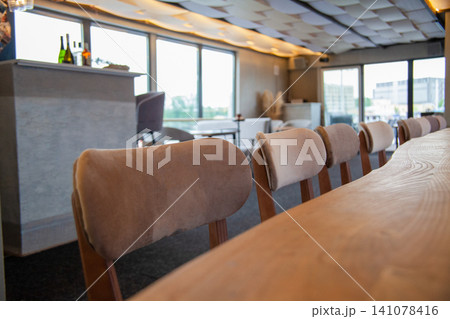 Cafe interior close up. Chairs and table Cafe interior close up. Chairs and table 141078416