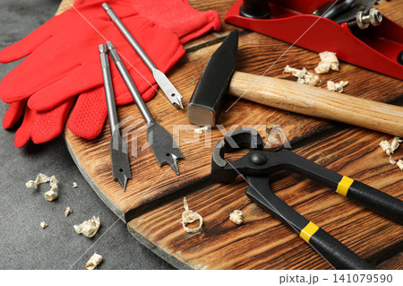 Set of modern carpenter's tools on grey table Set of modern carpenter's tools on grey table 141079590
