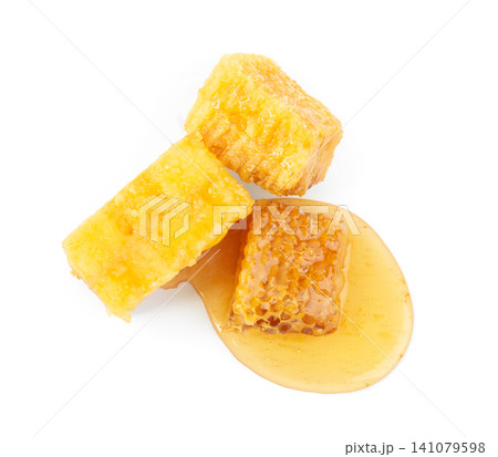 Pieces of tasty fresh honeycomb isolated on white, top view Pieces of tasty fresh honeycomb isolated on white, top view 141079598