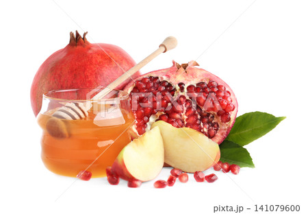 Honey, apples and pomegranate on white background. Rosh Hashanah holiday 141079600
