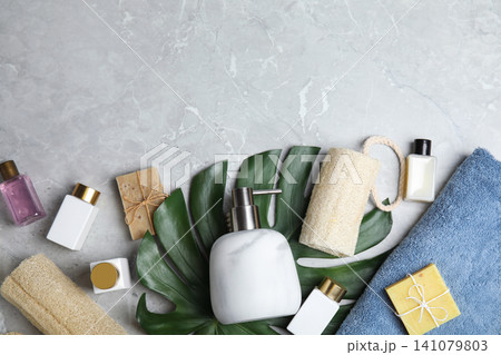 Flat lay composition with soap dispenser on grey marble background. Space for text 141079803