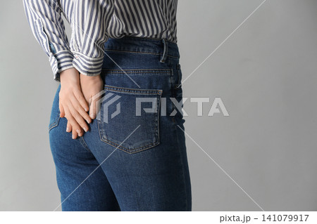 Woman wearing black tights and stylish shoes on light grey background, closeup of legs Woman wearing black tights and stylish shoes on light grey background, closeup of legs 141079917