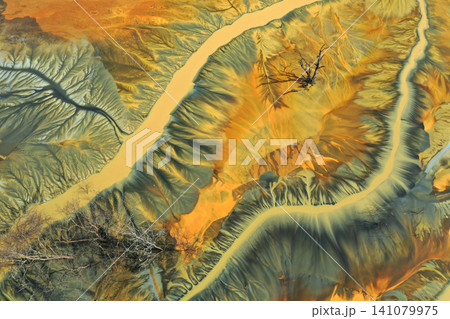 Surreal colorful natural pattern of mining waste waters in decanting lake aerial view 141079975