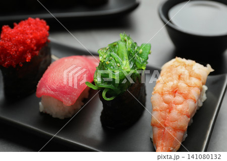 Set of delicious sushi on plate, closeup Set of delicious sushi on plate, closeup 141080132