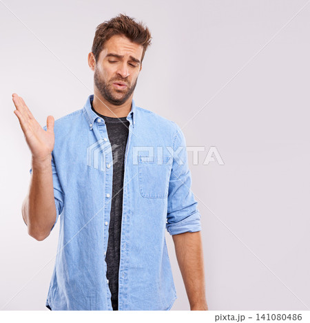 Smell, man and waving his hands for bad stink, poor hygiene and negative aroma on white studio background. Face, person or model with gesture or body odor with fart and disgust with yuck expression 141080486