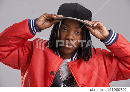 Fashion, attitude and portrait of child with style on gray background with confidence, pride and accessories. Youth, childhood and African boy with trendy clothes, stylish and casual outfit in studio Fashion, attitude and portrait of child with style on gray background with confidence, pride and accessories. Youth, childhood and African boy with trendy clothes, stylish and casual outfit in studio 141080792