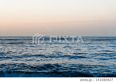 Sunlit Ocean Waves Sparkling With Golden Reflections 141080927