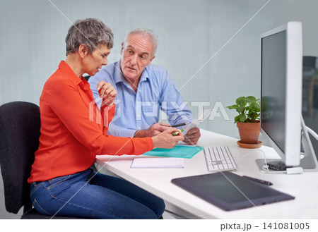 Paperwork, discussion and senior woman with financial advisor in planning for pension fund in office. Conversation, documents and elderly female person with finance consultant for retirement savings. 141081005