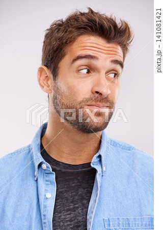 Thinking, confused and man with ideas, choice and emotion on white studio background with solution and emoji. Person, model and guy with decision and question with why, reaction and unsure doubt 141081421