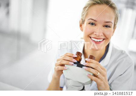 Happy woman, portrait and scientist with microscope for biology, chemistry or forensics at lab. Face of female person or medical expert with smile for test, exam or scientific research at laboratory 141081517