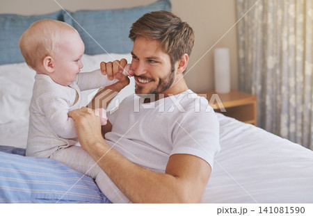 Family, playing and father with baby in bedroom for bonding, relationship and care for parenting. Happy, home and dad playing with newborn infant for child development, support and affection in house 141081590
