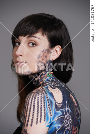 Woman, tattoo and portrait for creative, ink and design for picture and symbol for blue and colourful. Young person with art for bold, cool and statement for funky, trendy and unique for edgy Woman, tattoo and portrait for creative, ink and design for picture and symbol for blue and colourful. Young person with art for bold, cool and statement for funky, trendy and unique for edgy 141081767