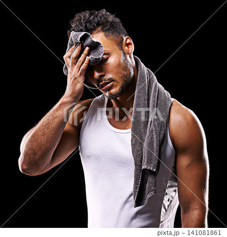 Fitness, sweat and man on black background with towel for exercise, training and intense workout. Bodybuilder, sports and serious person with muscles for performance, wellness and health in studio Fitness, sweat and man on black background with towel for exercise, training and intense workout. Bodybuilder, sports and serious person with muscles for performance, wellness and health in studio 141081861