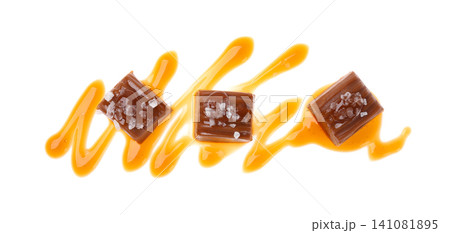 Delicious salted caramel with sauce on white background, top view Delicious salted caramel with sauce on white background, top view 141081895