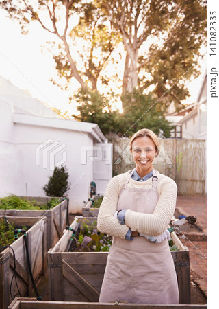 Gardening, portrait or woman in backyard with arms crossed or plants for landscaping, planting and growth. Agriculture, nature or happy person for outdoor environment, growing vegetables and nursery Gardening, portrait or woman in backyard with arms crossed or plants for landscaping, planting and growth. Agriculture, nature or happy person for outdoor environment, growing vegetables and nursery 141082335