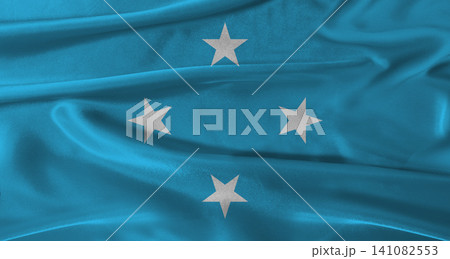 Flag of Micronesia with fabric textured background. Close up of National flag of Micronesia with realistic texture Flag of Micronesia with fabric textured background. Close up of National flag of Micronesia with realistic texture 141082553